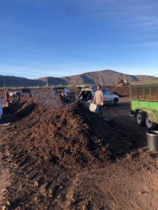 FPGS Customers loading Monkey Hair Mulch | SPVS