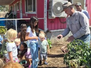 Dr. K and Kamron show the garden tomatoes to Butterflies and Bullfrogs | SPV Soils