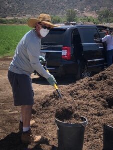 Wearing Protective Gear for Loading Monkey Hair Mulch | SPVSoils