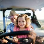Girl With Grandpa Driving Tractor | SPV Soils
